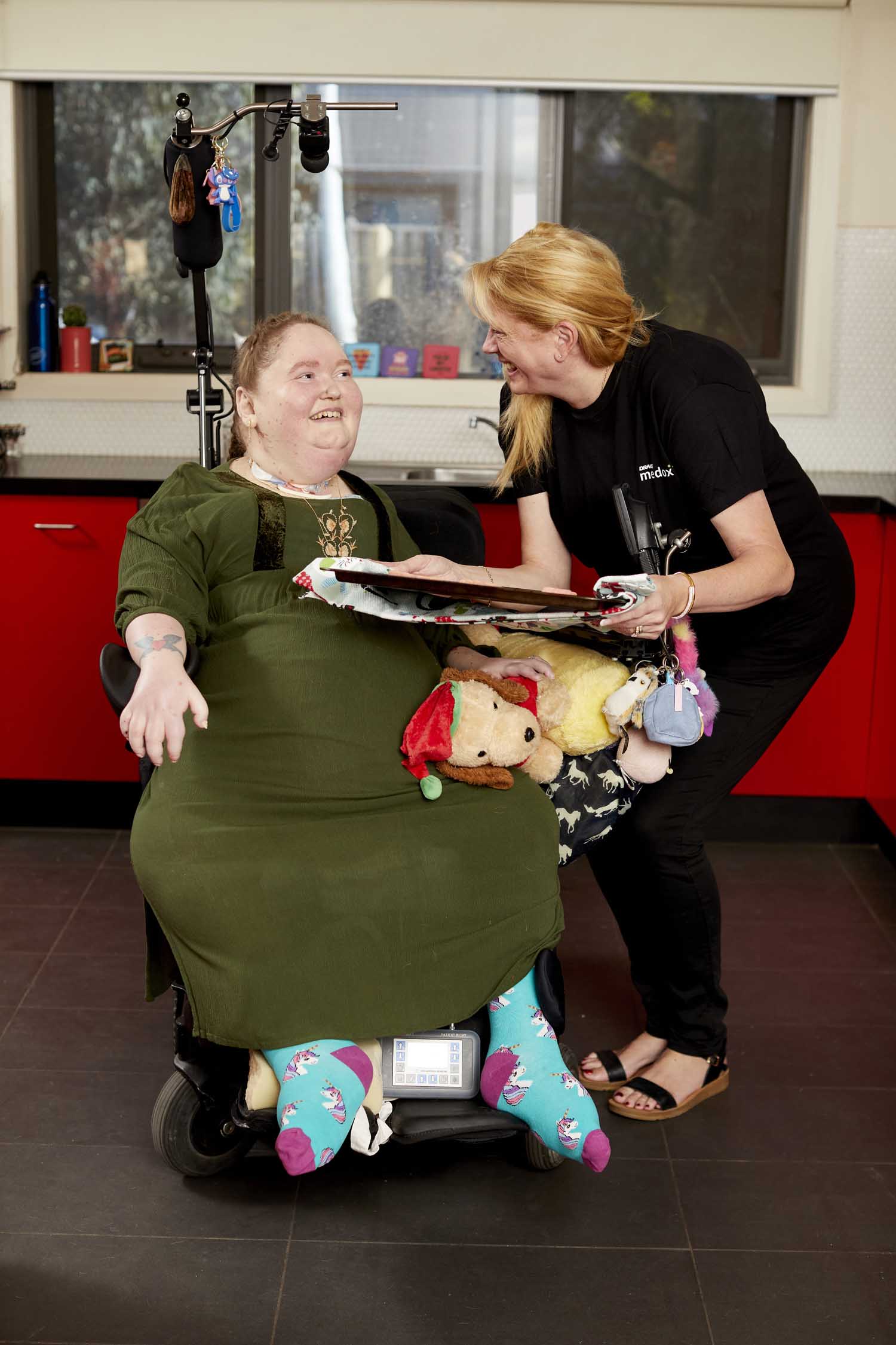 Client with support worker receiving care in home