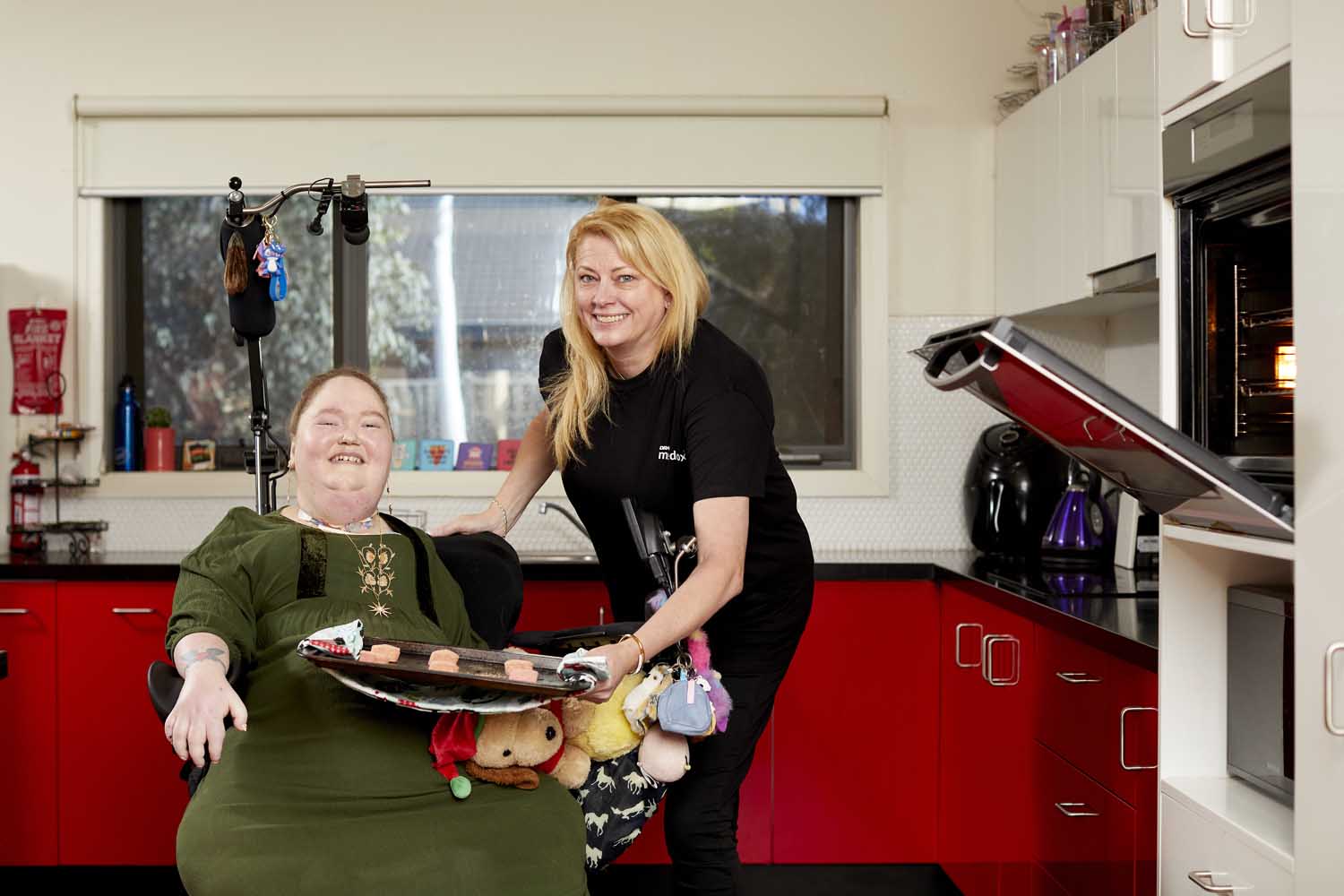 Client with support worker receiving care in home